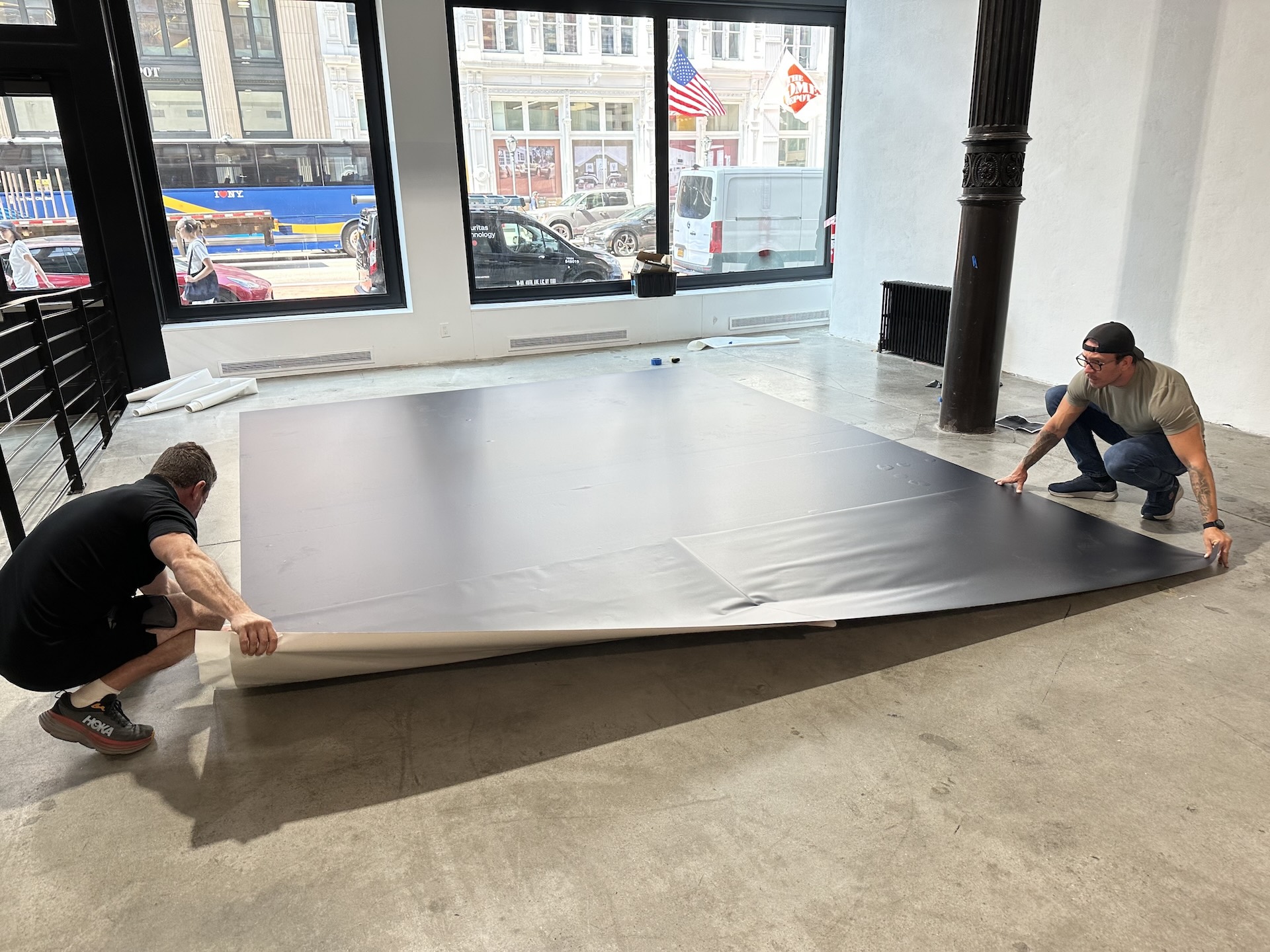 Two technicians working together while setting up for a live event