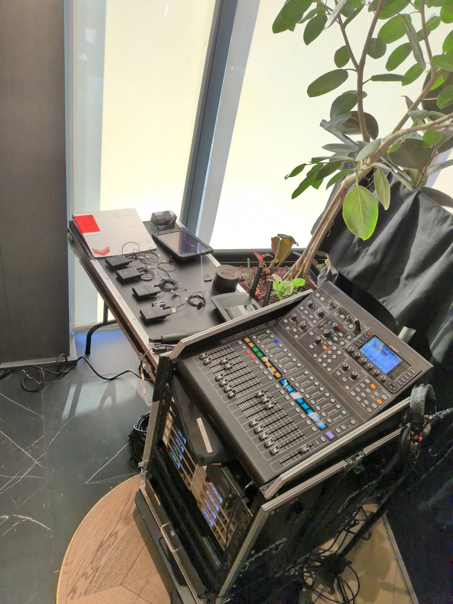 Lav and wireless microphones organized on a tech table