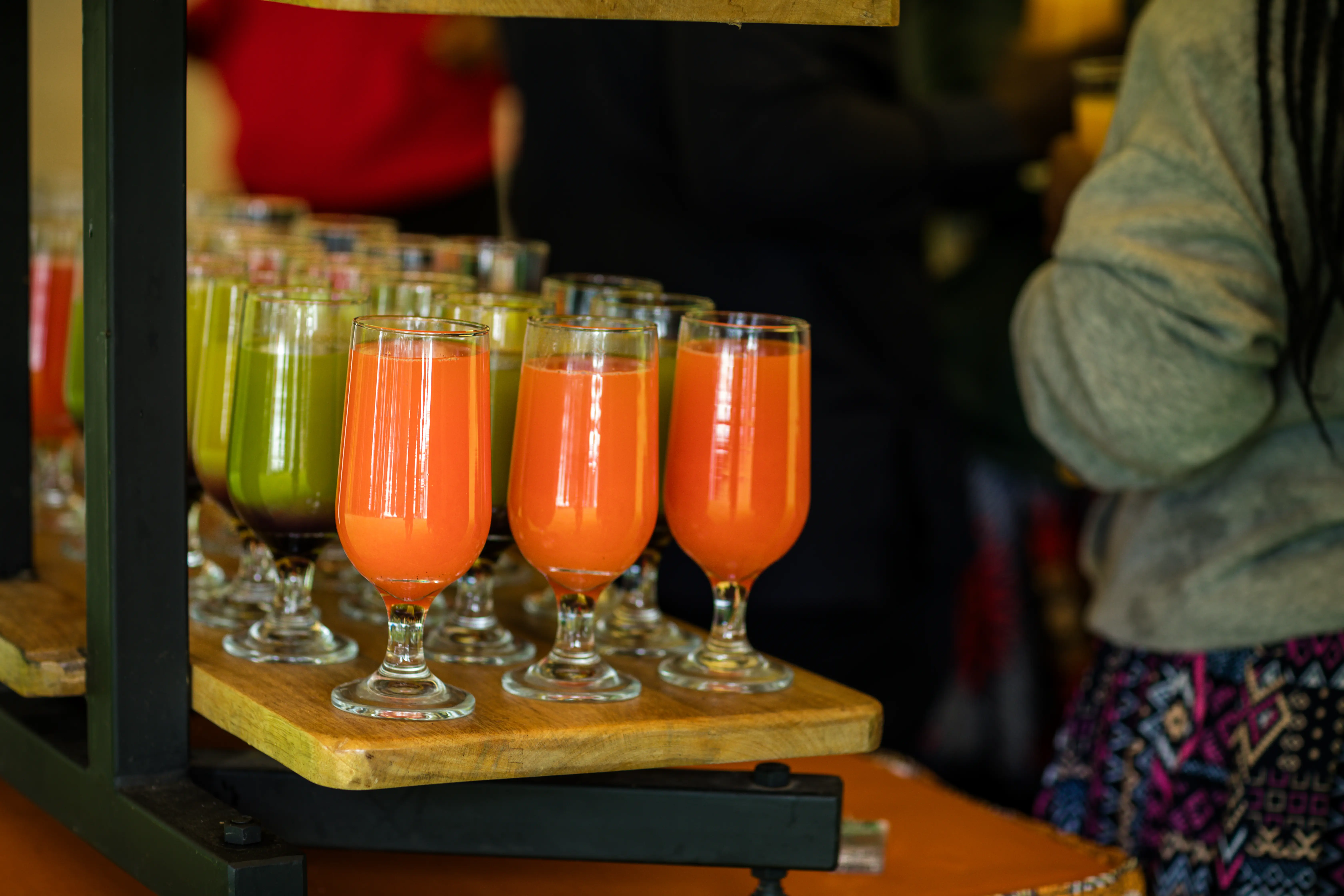 A vegetable and fruit juice bar in a wellness area at a conference